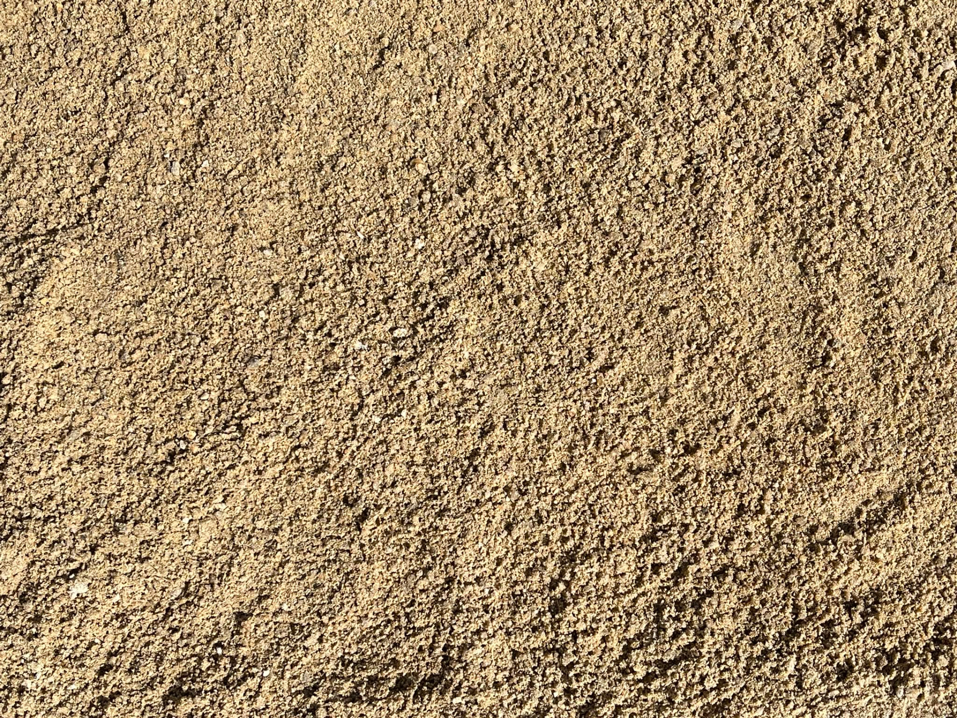 0x3 mm yıkanmış ince kumun yakın çekimi, homojen açık bej tanecikler
